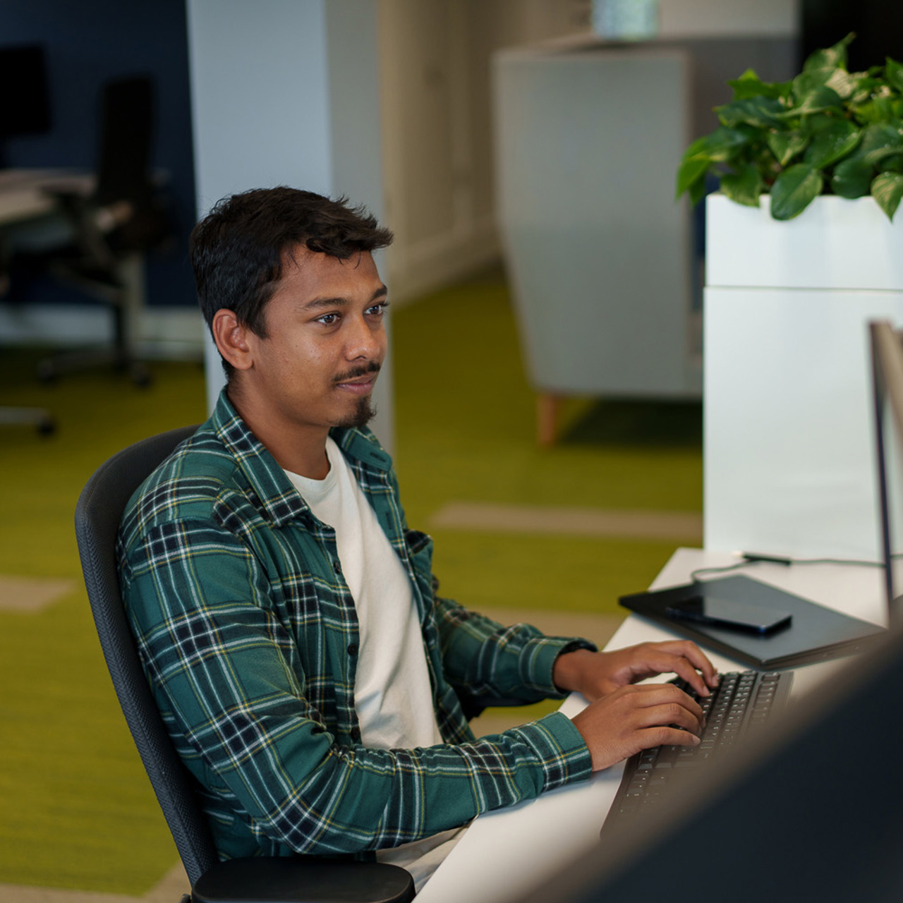 LCP employee sitting at desk in Winchester office